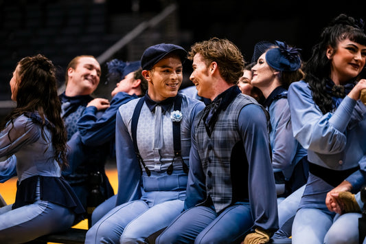 Étude members costumed in blue FJM uniforms during World Class Finals
